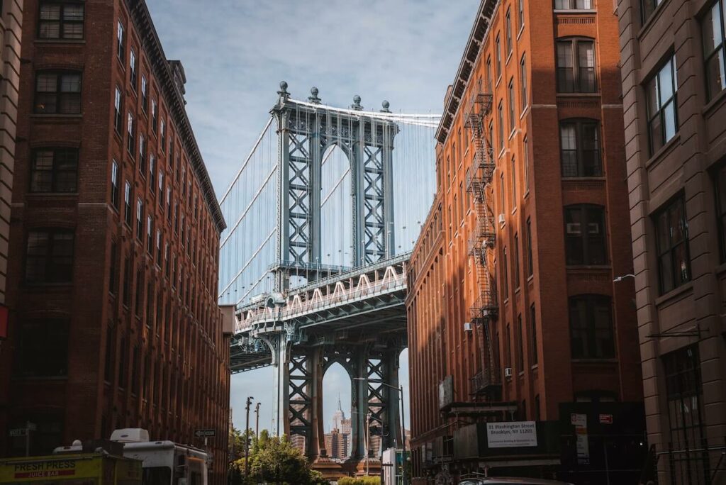 The Brooklyn Bridge viewed through an alley in Brooklyn