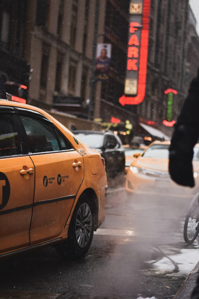 Taxi and cars while raining in New York City