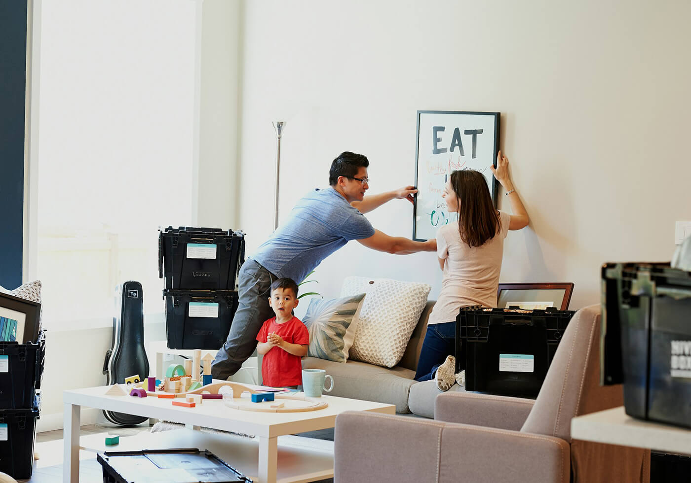 A couple and a child getting ready to move their apartment